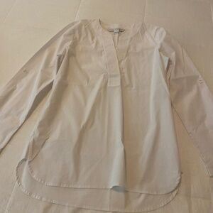 Diane Von Fursternberg white top with roll up sleeves, buttons at each sleeve
